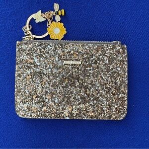 Kate Spade Glittery Card holder. New w/o box. MSRP $89.00. Price: $35.00.